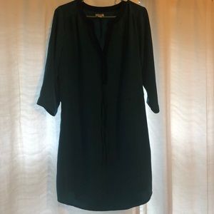 Teal dress, cinched at waist with tie